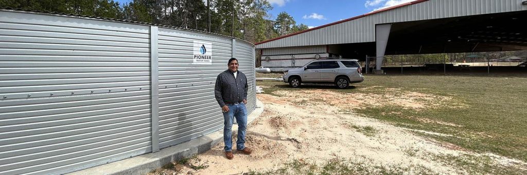 Elliot Abbey, Deputy Tribal Administrator for Community Development, helped oversee the installation of the 65,000-gallon storage tank which holds rainwater harvested from the adjacent Veteran’s Pavillion. (Photo: USDA Natural Resources Conservation Service)