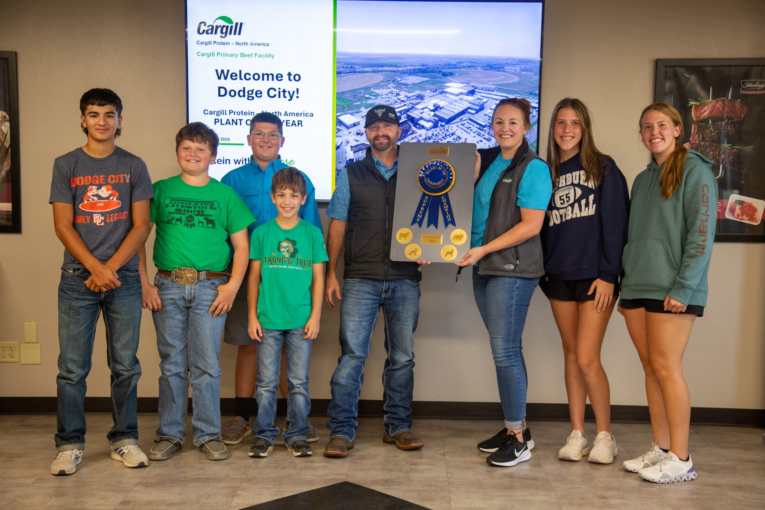 Ford County 4-H members recently visited Cargill to learn about their beef project carcass data and present Cargill with an appreciation award. Pictured from left includes: Finn Martinez, Chance Scott, Shaun Scott, Chase Martinez, Jeremy Burr, assistant vice president/general manager at Cargill Protein in Dodge City, Gracie Borgelt of Cargill, Hannah Durler and Becca Durler. (Journal photo by Kylene Scott.)