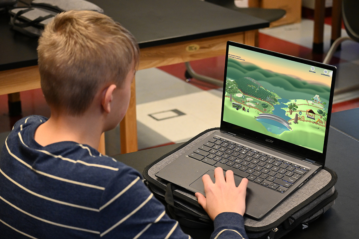 A child playing the Water Rocks! conservation game. (Photo: Iowa State University Extension and Outreach)