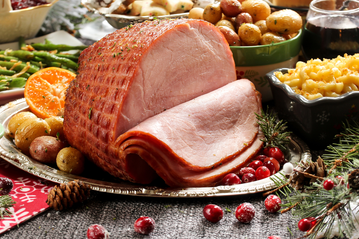 Holiday baked Ham with sides green beans,roasted potatoes, mac and cheese ,cookies and pumpkin pie. (Photo: iStock - vm2002)