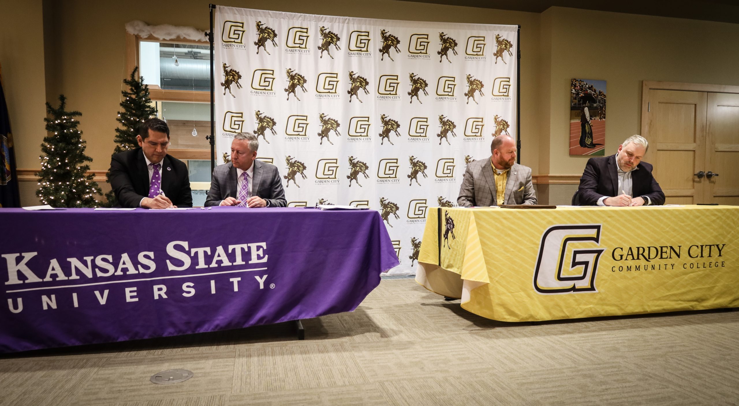 From left: Jesse Perez Mendez, Kansas State University provost and executive vice president, and Richard Linton, K-State president, signing the official memorandum of understanding with Ryan Ruda, Garden City Community College president, and Marc Malone, GCCC vice president for instructional services and chief academic officer, on Dec. 11 at Garden City Community College. (Courtesy photo.)