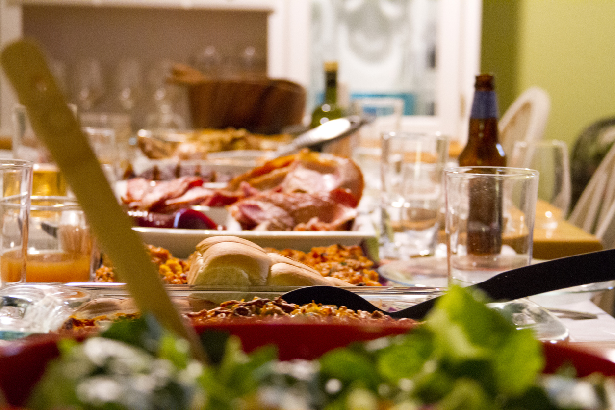 Table is set for Thanksgiving meal with food. (Photo: iStock - ShootingRichard)