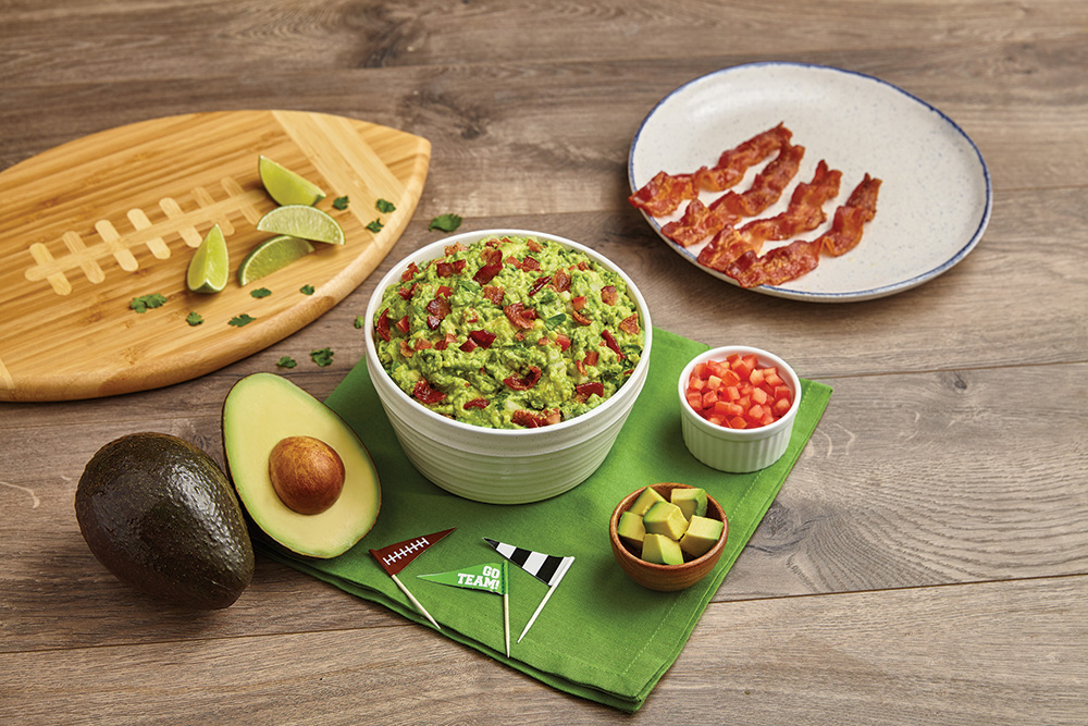 Because it's not game day without guac, start the party by mashing up a bowl of Championship Guac. (Photo: Family Features)