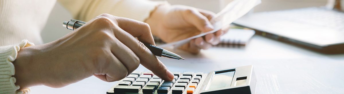 Women doing paperwork for paying taxes. (Photo: Adobe Stock │ #352198814 - Pcess609)