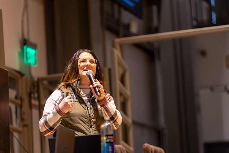Kara Lee, director of producer engagement at Certified Angus Beef, presents "Marbling, Feed and Fertility," a discussion surrounding both maternal and carcass traits. (Courtesy photo.)