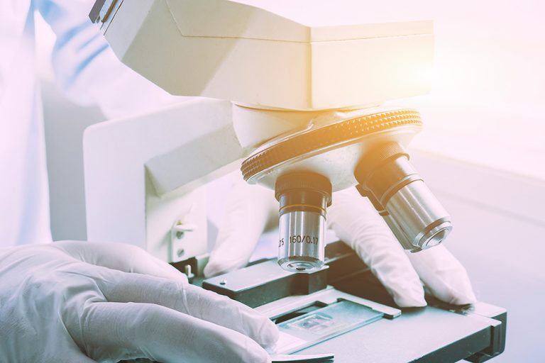 Scientist using microscope for chemistry test samples. (Adobe Stock │ #141280834 - Have a nice day)