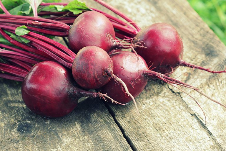 Fresh beetroot on rustic wooden background. (Adobe Stock │ #176227440 - vaivirga)