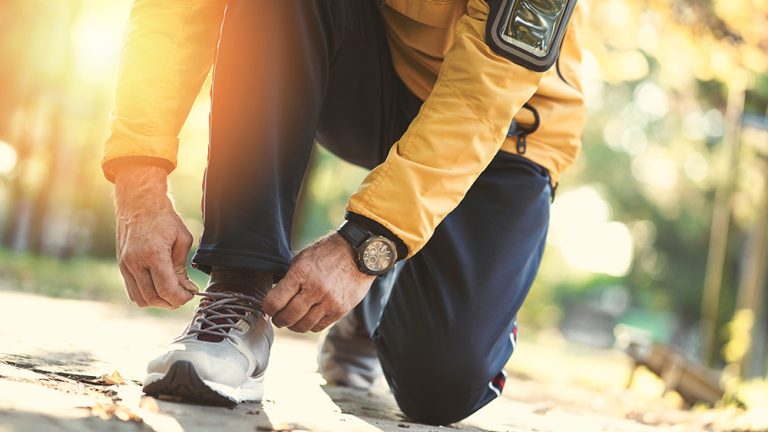 Man jogging in the park. (Adobe Stock │ #296934644 - sebra)