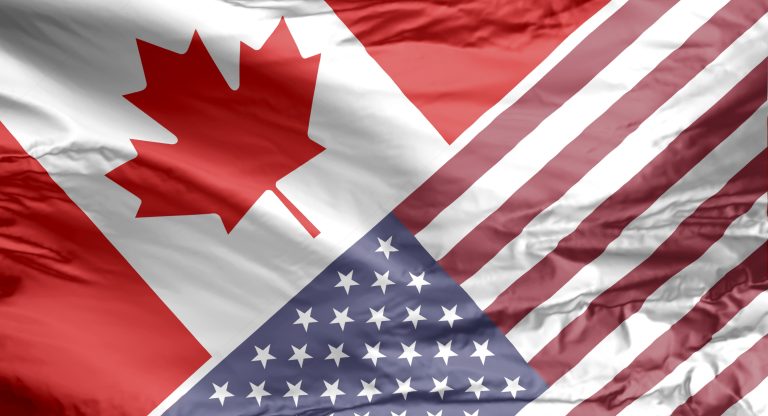 Canadian and American flag. (iStock │ #1303526800 - Marvin Samuel Tolentino Pineda)