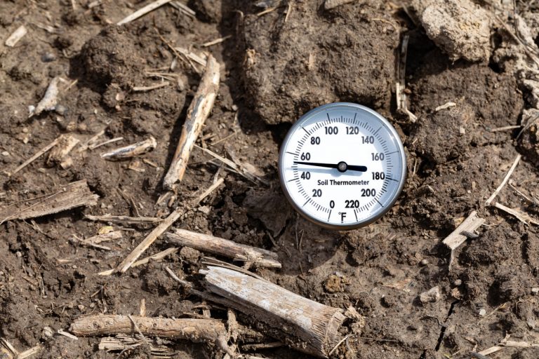 Soil thermometer in soil of farm field. (iStock │ #2148452446 - JJ Gouin)