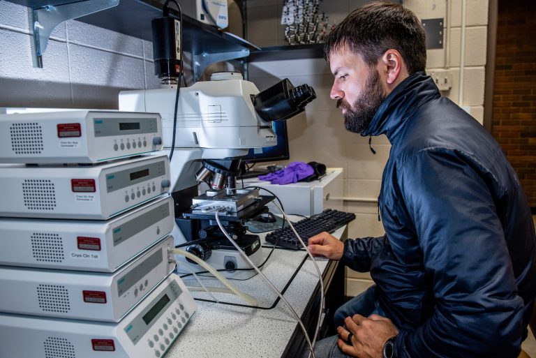 Montana State University researcher Kevin Hammonds studies ice samples in the SubZero laboratory in this 2018 file photo. (Montana State university photo by Kelly Gorham.)
