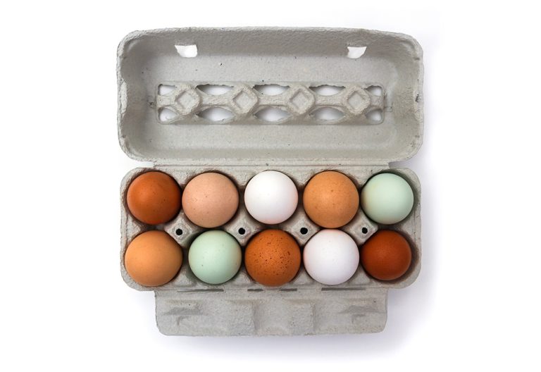 Ten colorful chicken eggs in carton box. (iStock │ #1089787168 - diamant24)