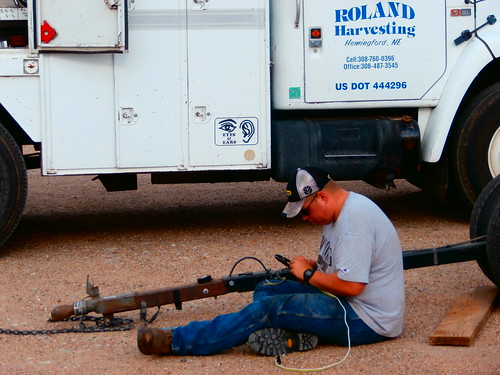 Matt doing electrical work on the header trailer