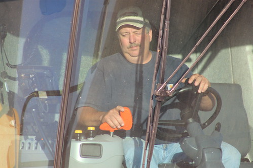Dad, logging in a few more hours in the combine.