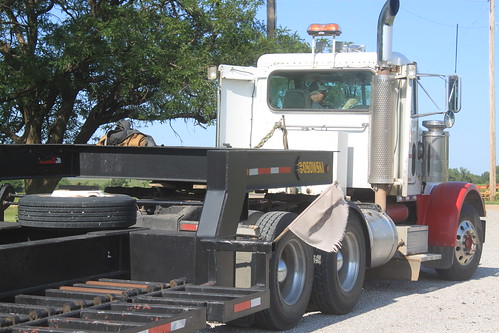 Dad getting the trailer all situated to load up the combine.