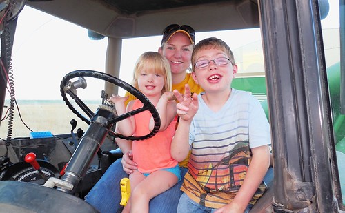 Ava, Zach, and Megan in the tractor