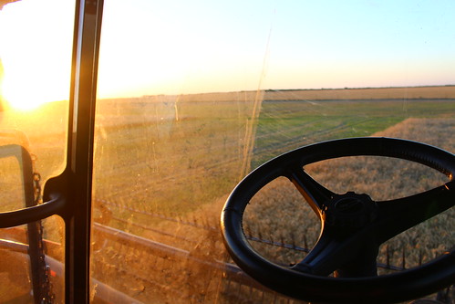 Combine cab sunset.