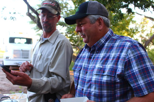 Dad and Jethro of Sanders Harvesting -- can't really tell you what they were doing though.