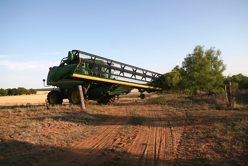 Adam walks the combine through a small gate