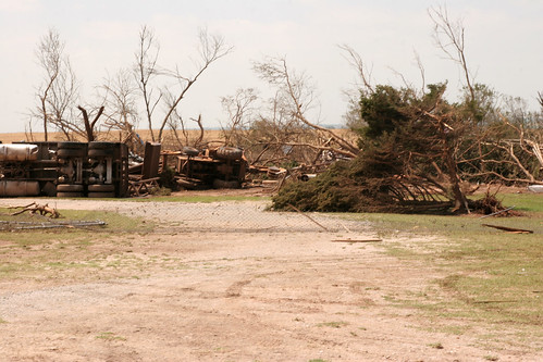 A truck and a backhoe turned over from the storm.