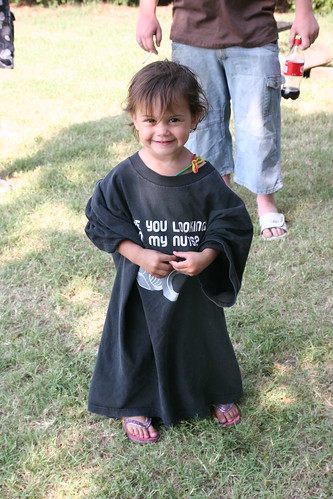 Kaidence trys on a shirt to fit in