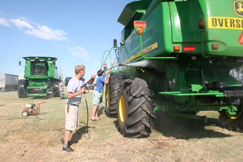 Andreas and Oak clean a combine off.