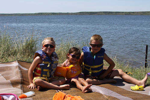 Cool dudes and chick chilling by the river