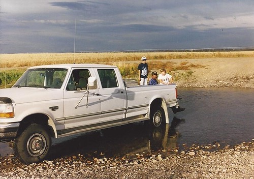 Dad and kids in river