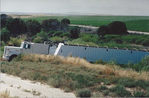 Truck driving through river