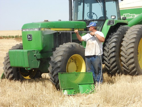 Greg washes out the radiator on the tractor