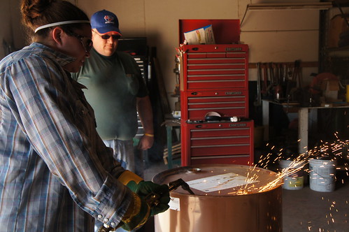 Abby learning how to cut with a torch