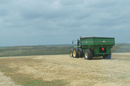 The grain cart heading down the field
