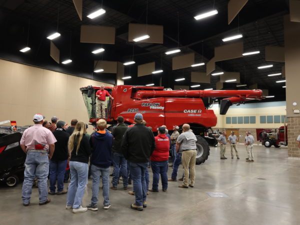 A Case IH representative covering safety precautions on a combine.