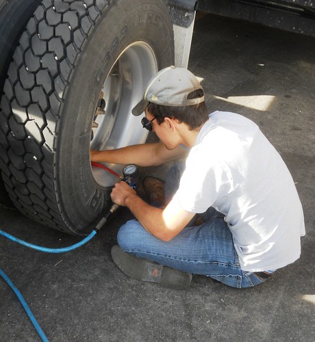 Brandon airs up a low tire