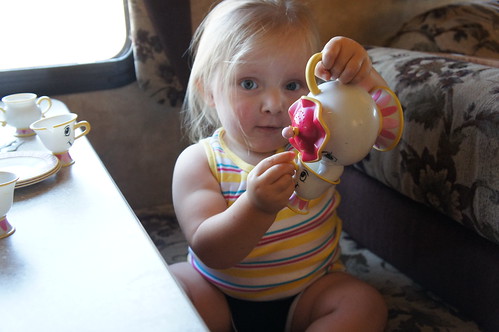 Evie pouring tea from Mrs. Pots :)