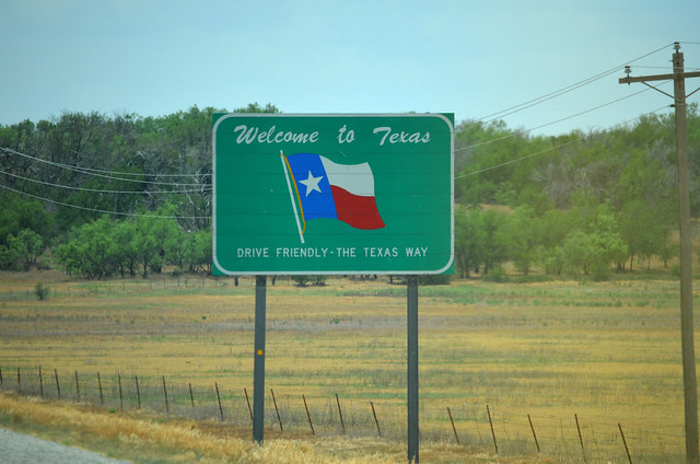 The sign to Texas is a welcome sight after several miles of driving