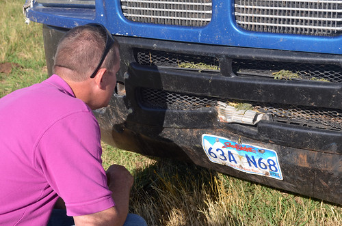 Leon inspects how bad the radiator damage is