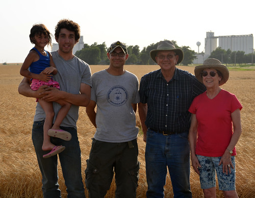Oak holding Kaidence James Ross and Jeannie pose in the field