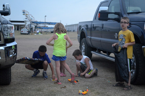 The kids pick up the confetti from their flameless fireworks