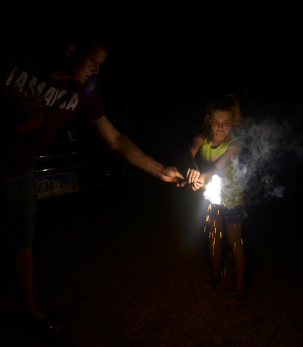 Leon gets a sparkler ready for Kaitlyn