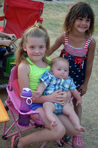 Kaidence with Kaitlyn Hoerner of Craig Hoerner Harvesting holding Bentley of Neumiller Harvesting