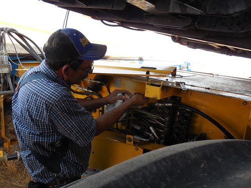 Dad fixing a hydraulic leak