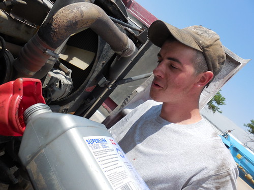 Eric putting oil in the semi