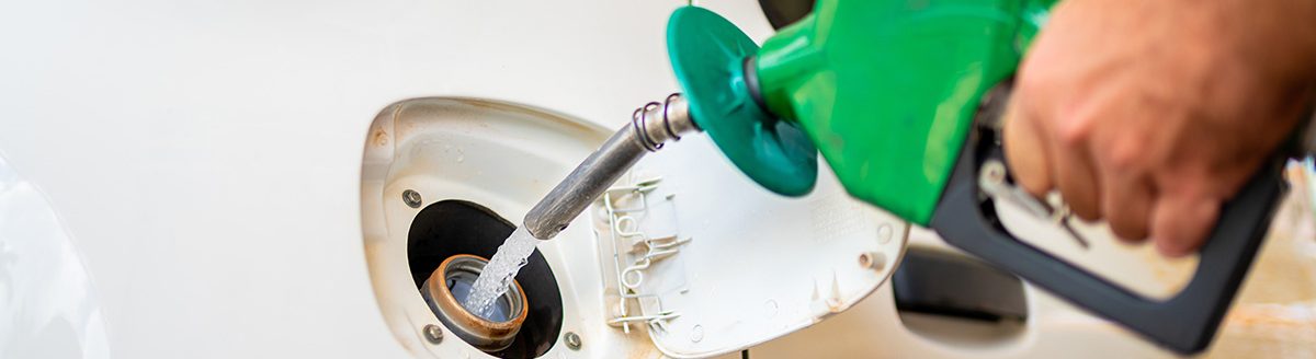 Closeup of man pumping ethanol fuel in car at gas station. (iStock │ #426749865 - pancaketom)