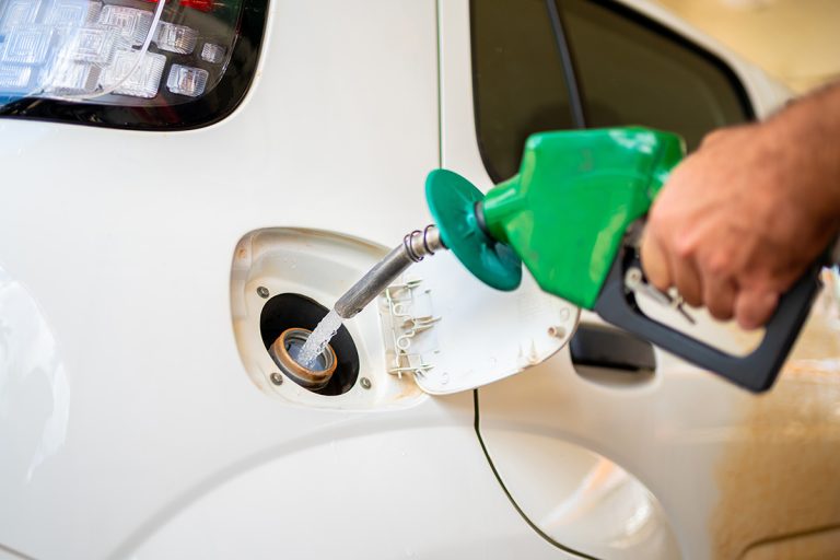Closeup of man pumping ethanol fuel in car at gas station. (iStock │ #426749865 - pancaketom)