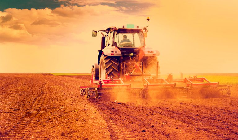 Farmer in tractor preparing land for sowing. (Adobe Stock │ #68259903 - oticki)
