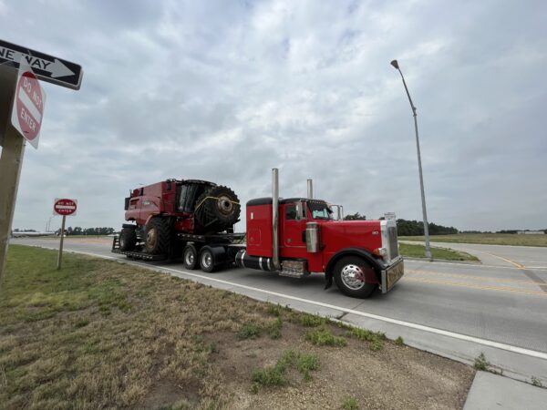 One of the trucks moving by before the campers jump in line during the move to Tribune, Kansas. 