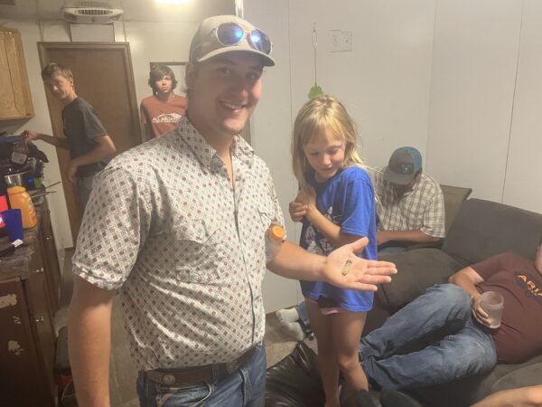 Josh with the rattler he cut off. 