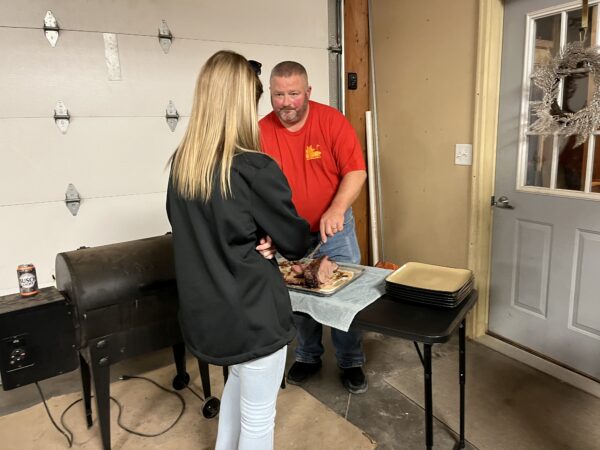 Jeremy Kleve, Paul's sister's husband, serving up a slice of prime rib for his daughter, Breanna.