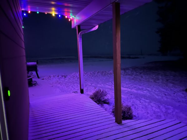 Just this morning, the deck was clear. The snowy mix is coming down now, as Paul is making his way home from Nebraska.